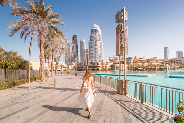 Woman walking along Dubai marina