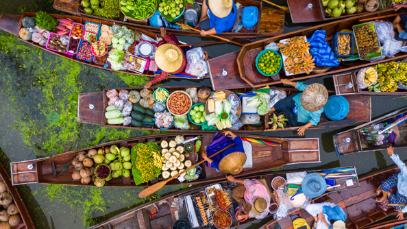 Aerial view of traders on a boat at a floating market in Thailand