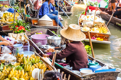 Traders at a floating market in Thailand