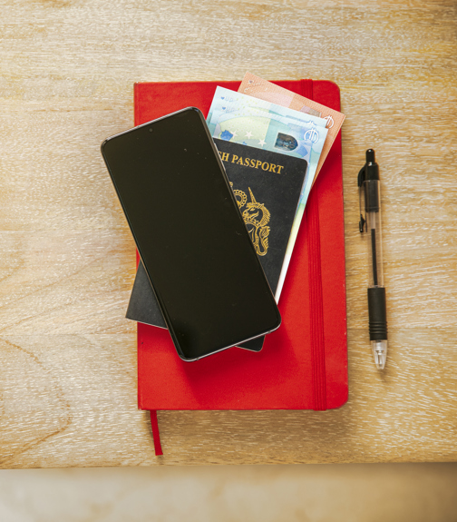 Passport, phone and notebook