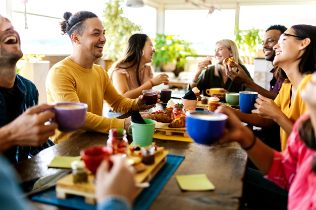 Friends smiling at a restaurant table